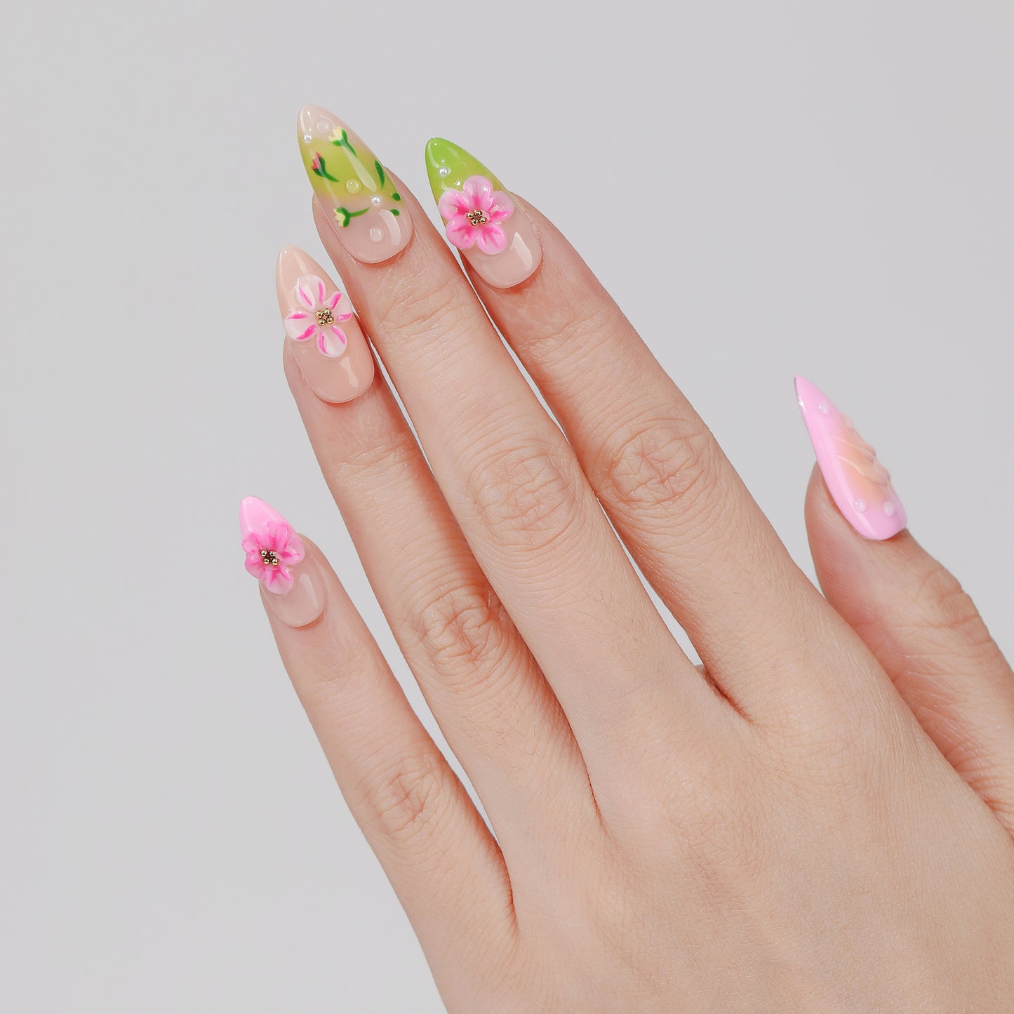 Spring Bouquet almond press-on nails hand close-up