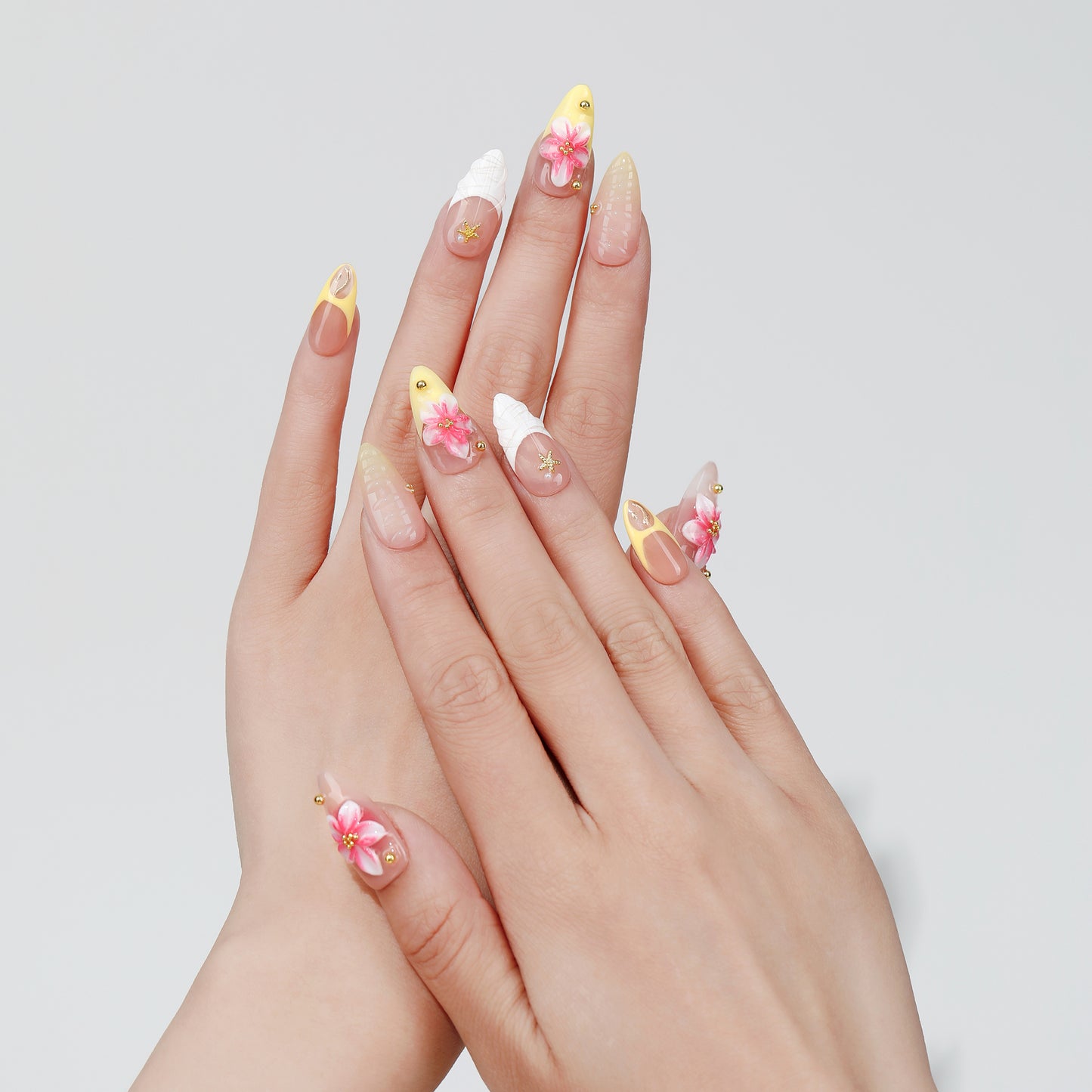 Petal Trace almond press-on nails hand close-up