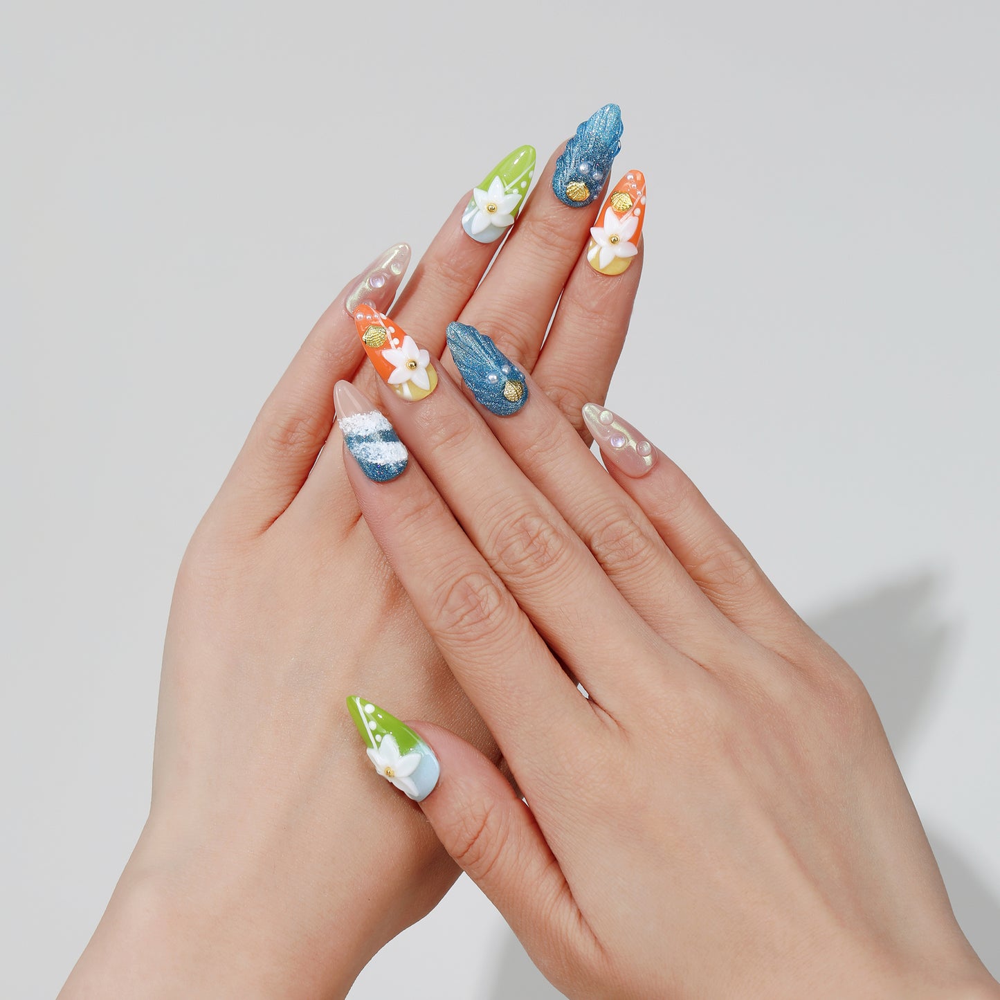 Ocean Breeze almond press-on nails hand close-up