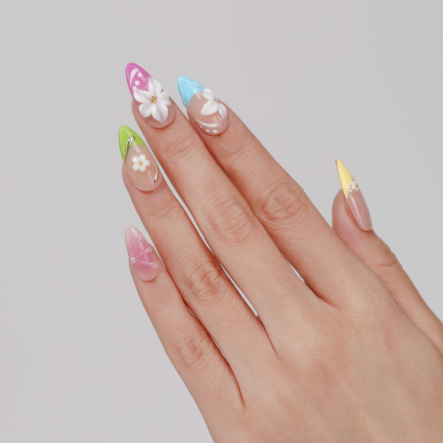 Candy Bloom almond press-on nails hand close-up