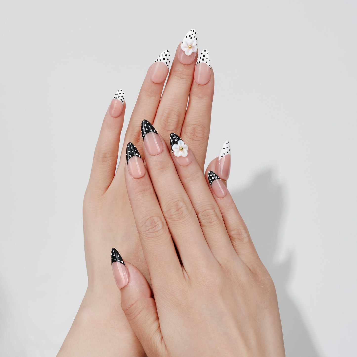 Duo Dot almond press-on nails hand close-up