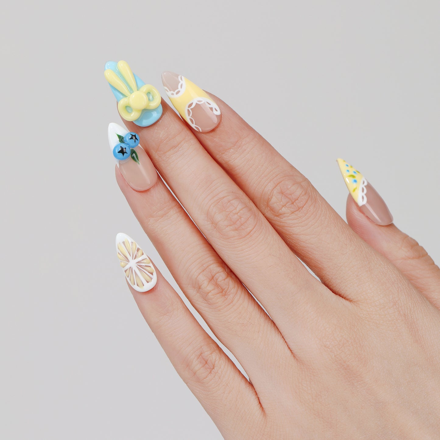 Cherry Star almond press-on nails hand close-up