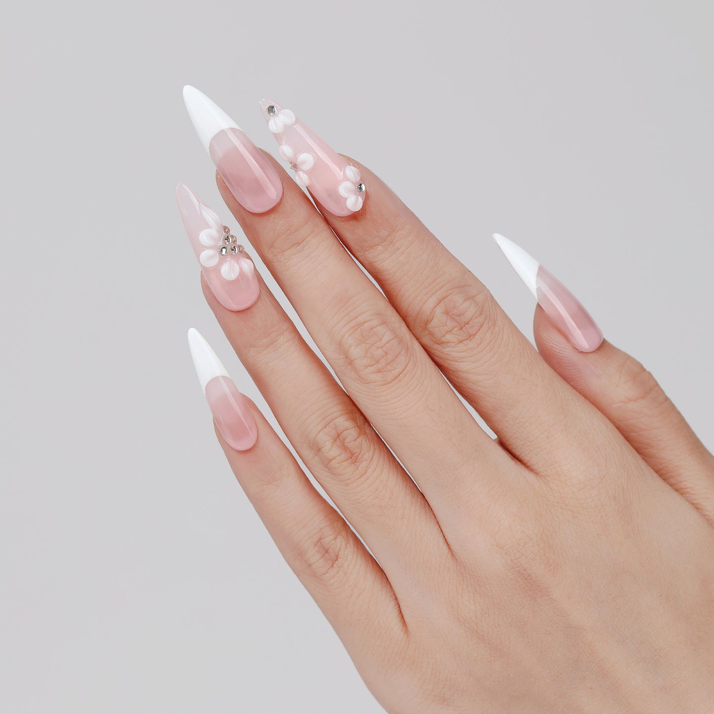 Rose French long almond press-on nails hand close-up