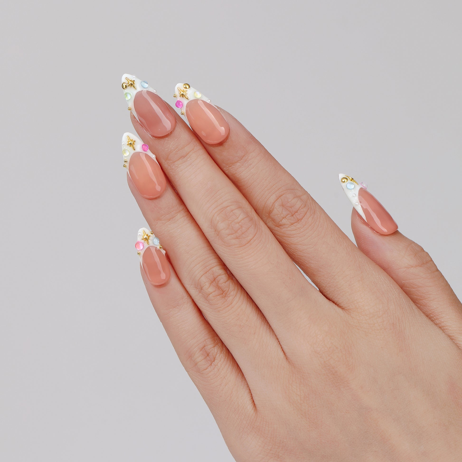 Multicolor Rhinestones almond press-on nails hand close-up