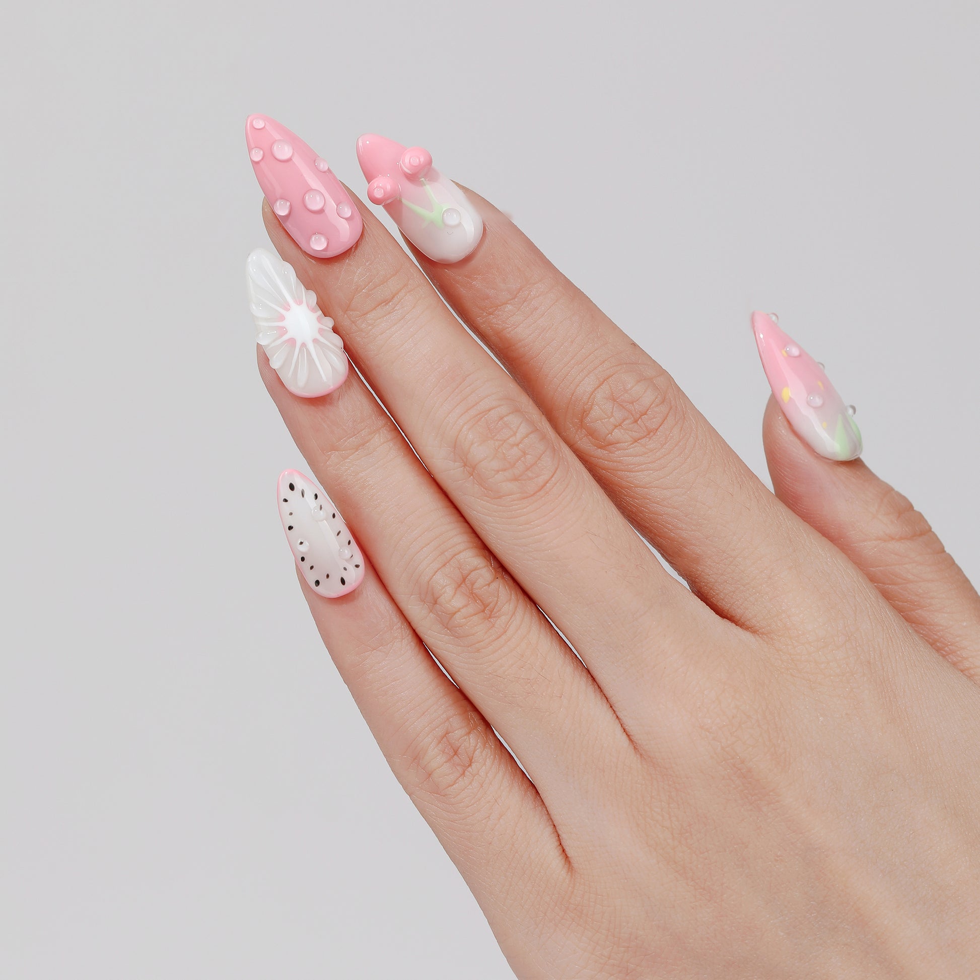 Berry Picnic almond press-on nails hand close-up
