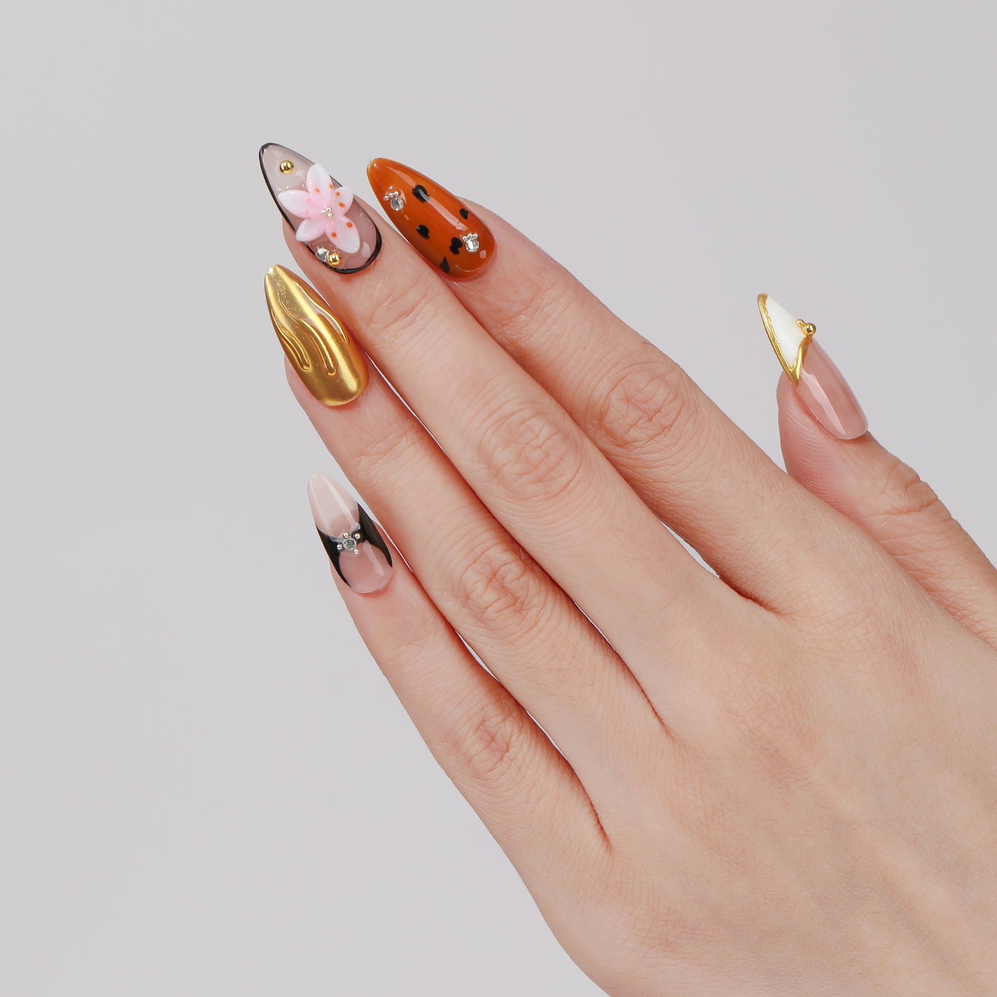 Dotty Peony almond press-on nails hand close-up