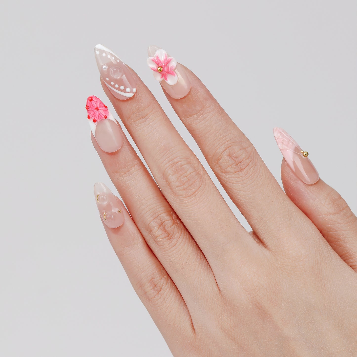 Folk Garden almond press-on nails worn on hand