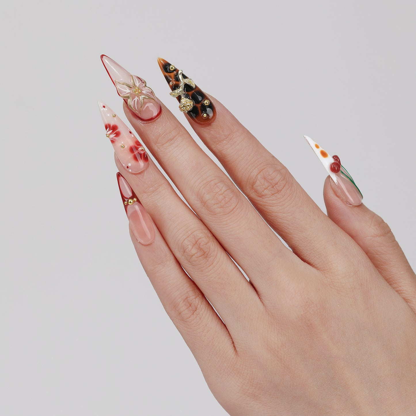 Cherry Haze long almond press-on nails worn on hand