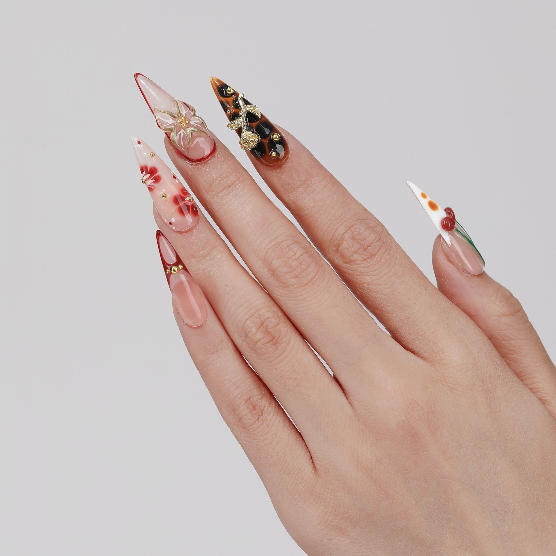 Cherry Haze long almond press-on nails worn on hand