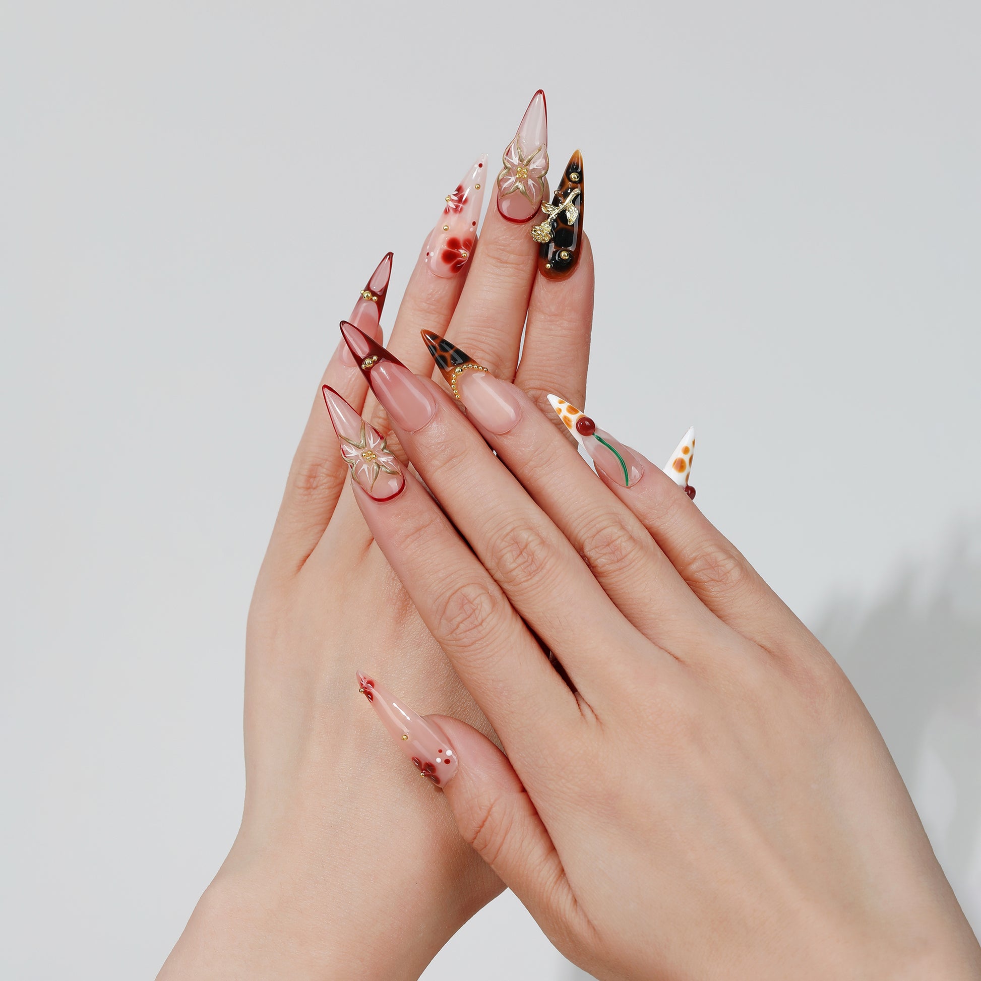 Cherry Haze long almond press-on nails hand close-up