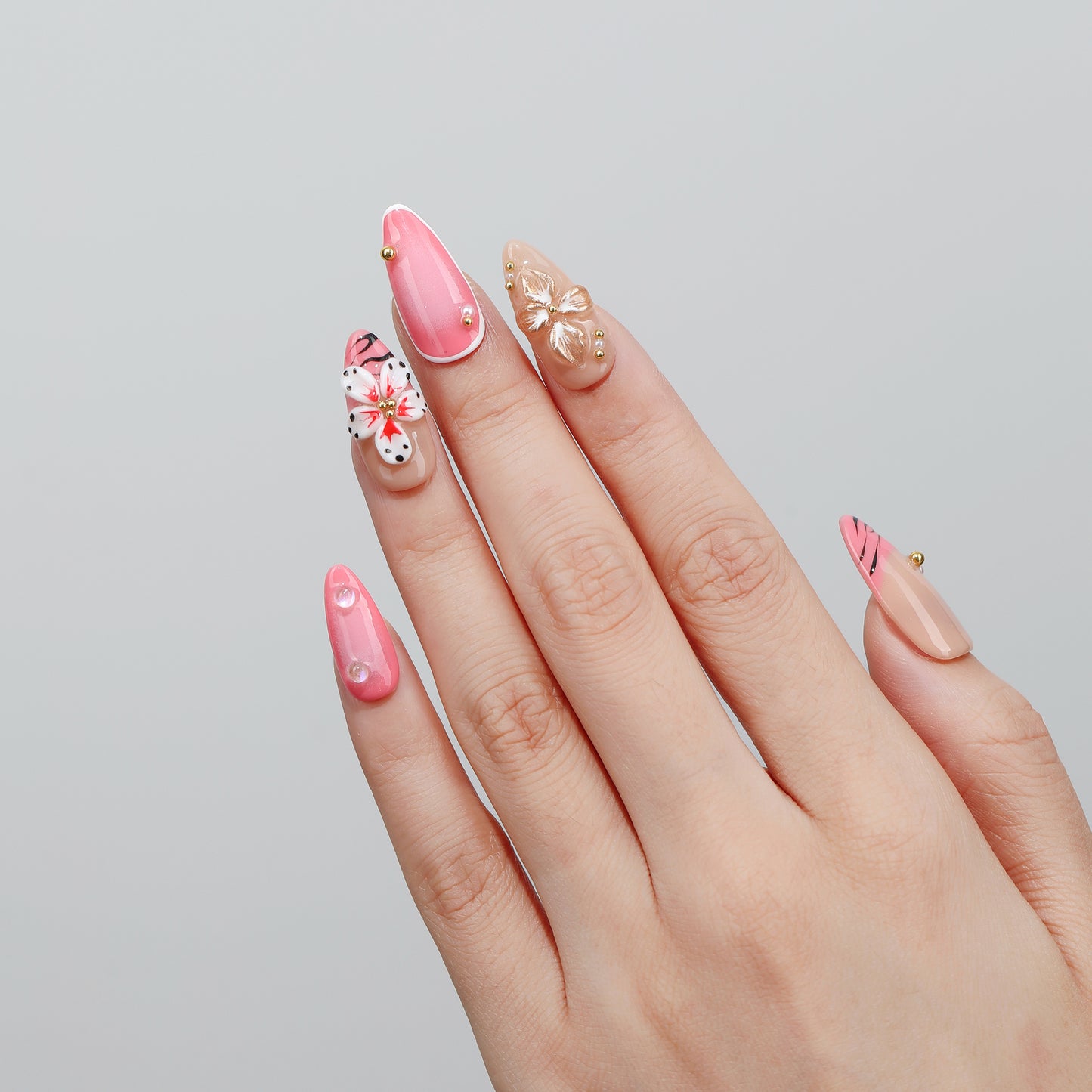 Vine & Bloom almond press-on nails worn on hand