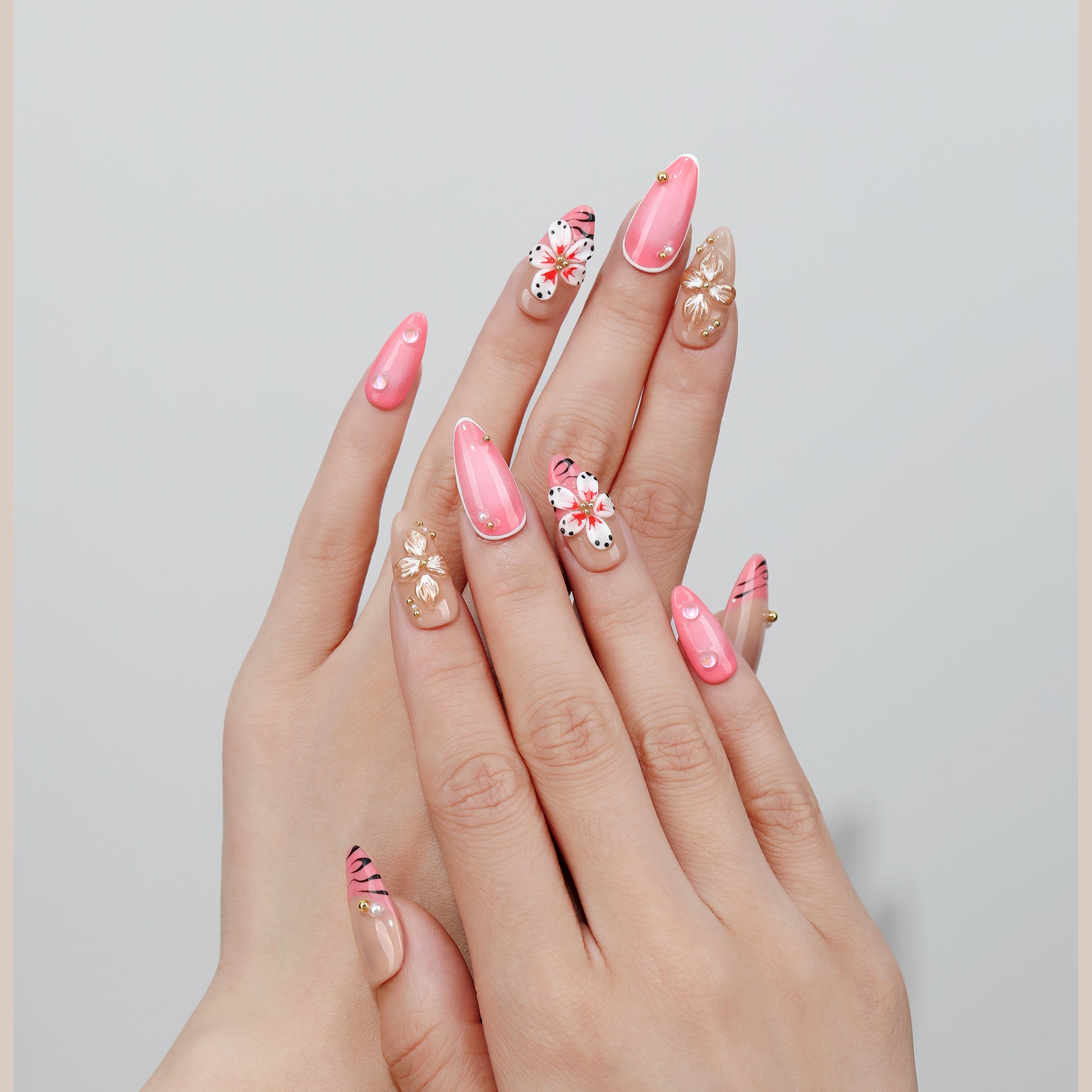 Vine & Bloom almond press-on nails hand close-up