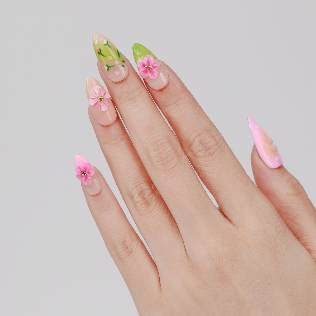 Spring Bouquet almond press-on nails hand close-up