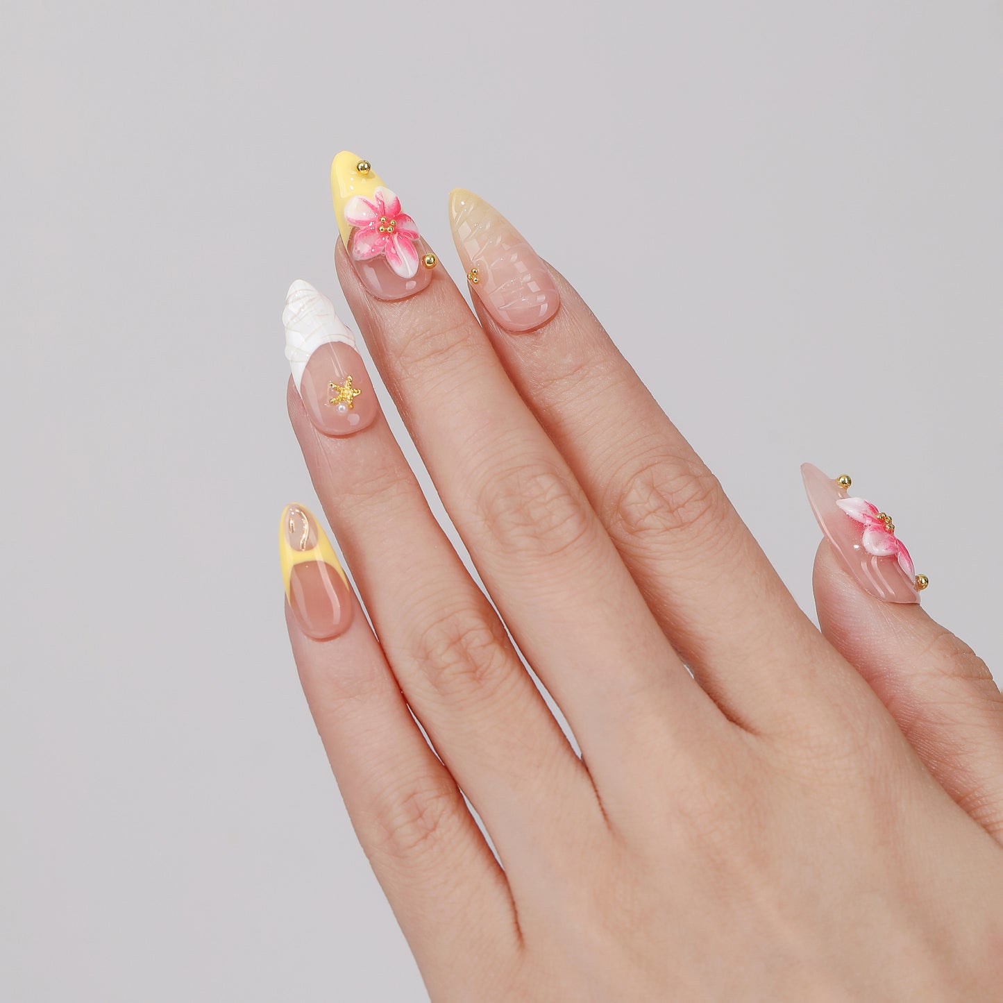 Petal Trace almond press-on nails worn on hand