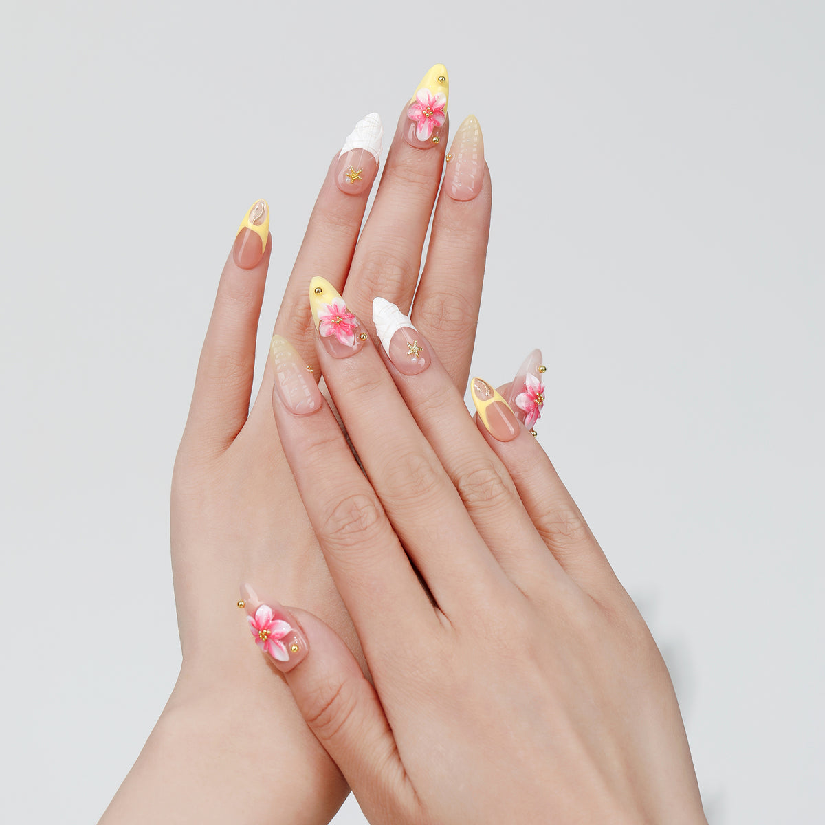 Petal Trace almond press-on nails hand close-up