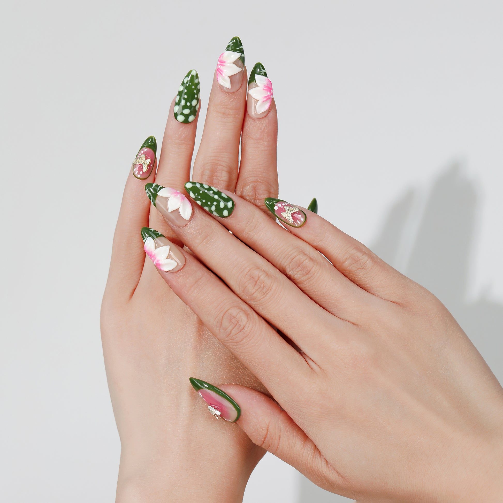 Green Sketch almond press-on nails worn on hand