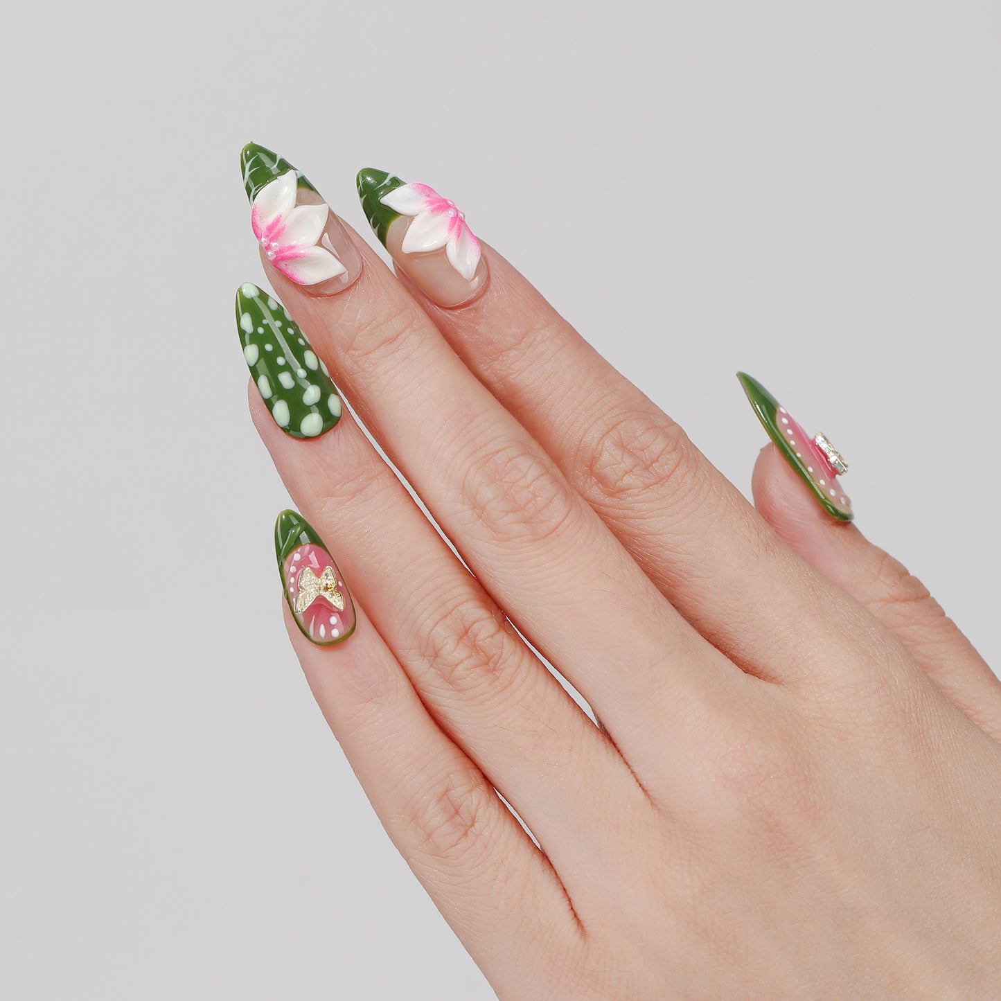 Green Sketch almond press-on nails hand close-up