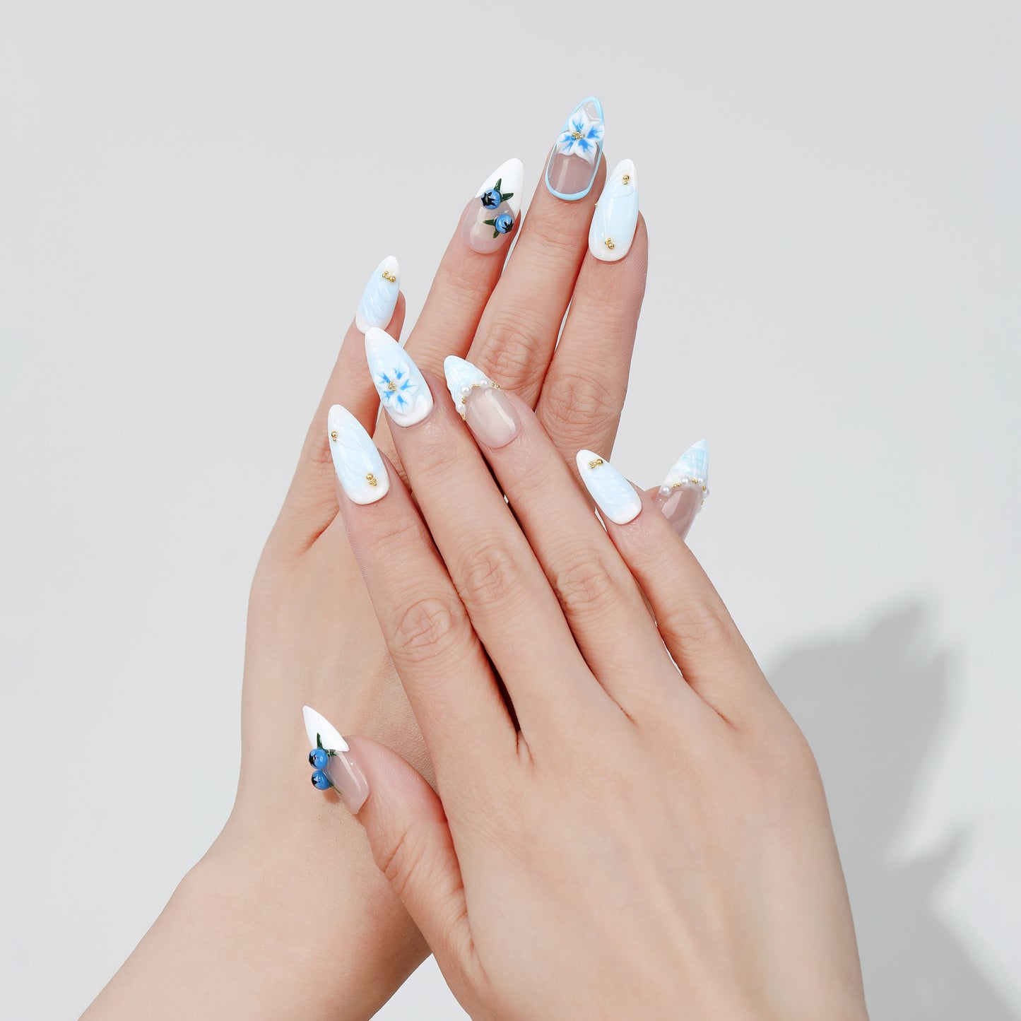 Blueberry Vine almond press-on nails worn on hand