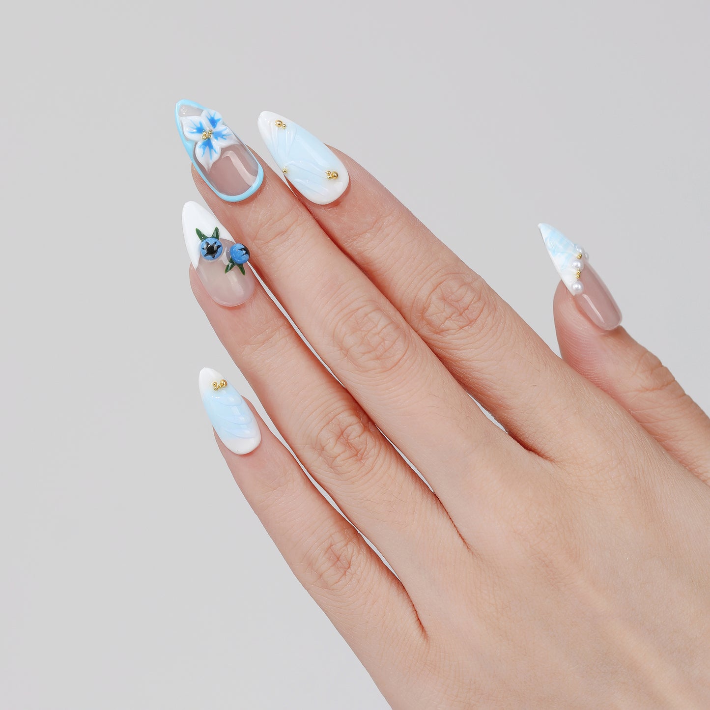 Blueberry Vine almond press-on nails hand close-up