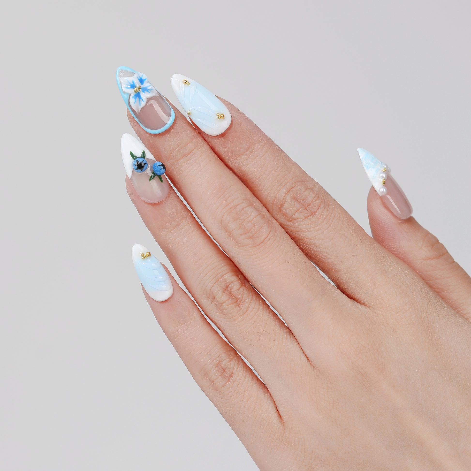 Blueberry Vine almond press-on nails hand close-up