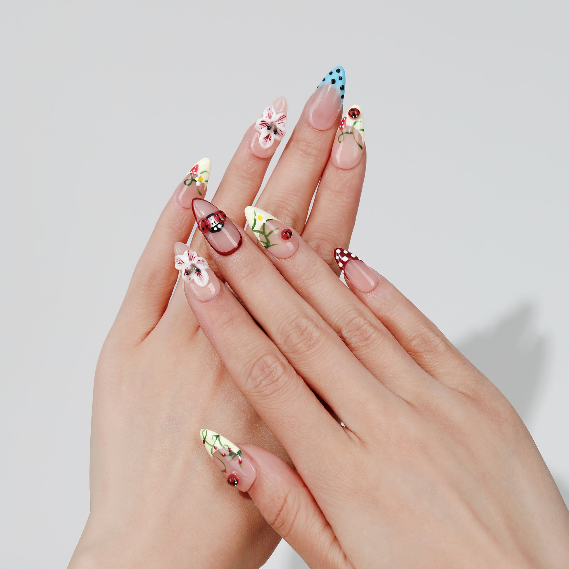 Confetti Daisy almond press-on nails hand close-up