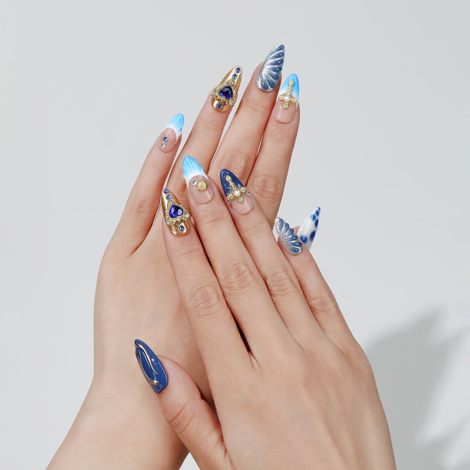 Midnight Heart almond press-on nails worn on hand