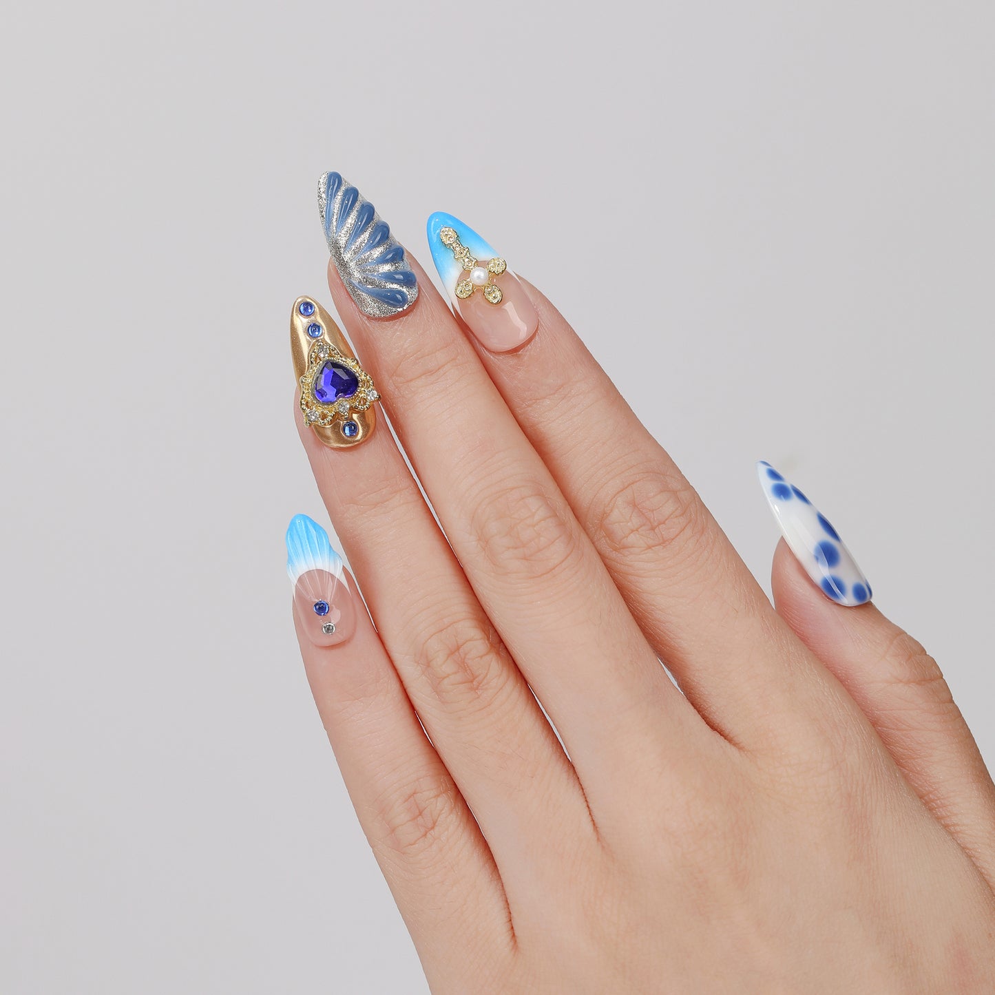 Midnight Heart almond press-on nails hand close-up