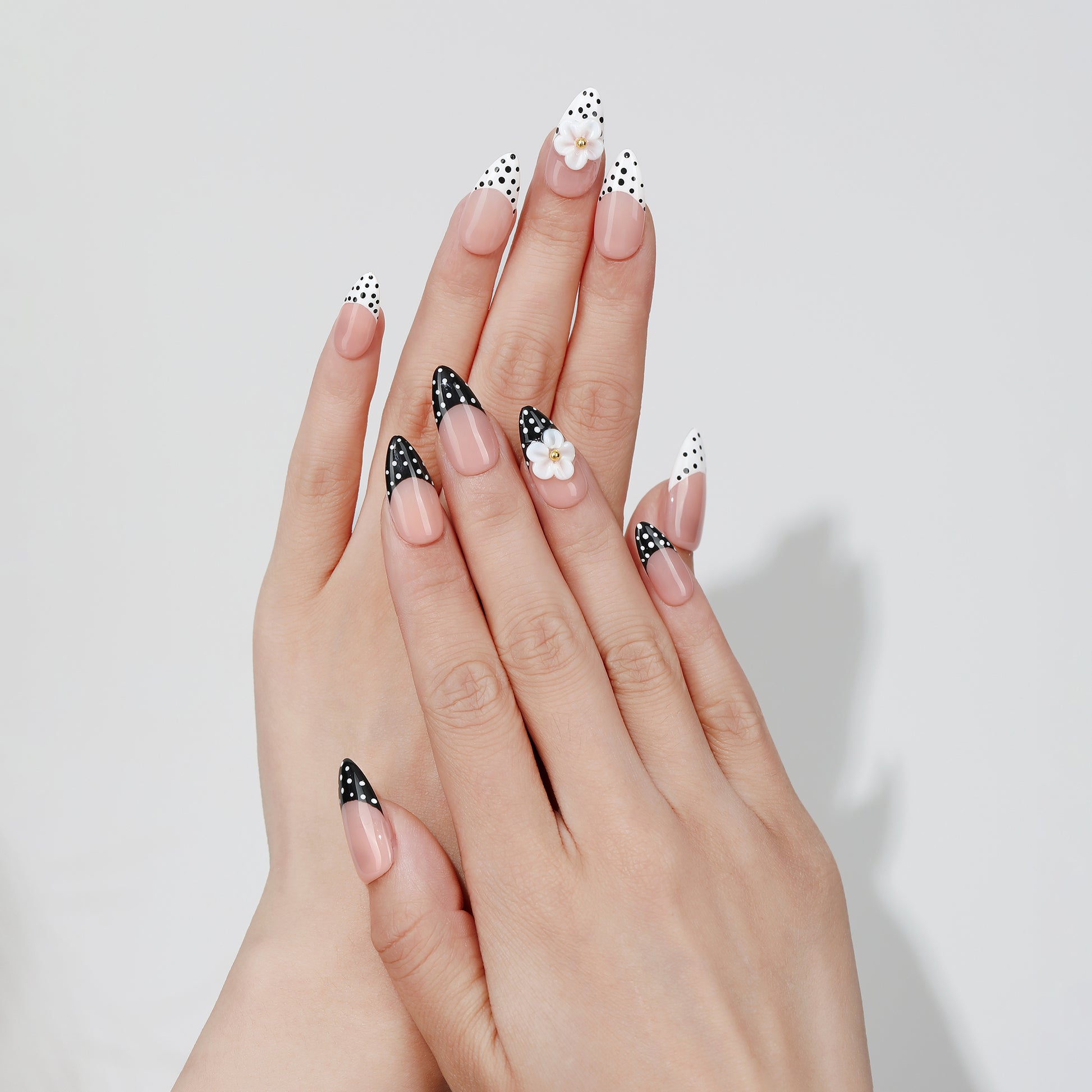 Duo Dot almond press-on nails hand close-up