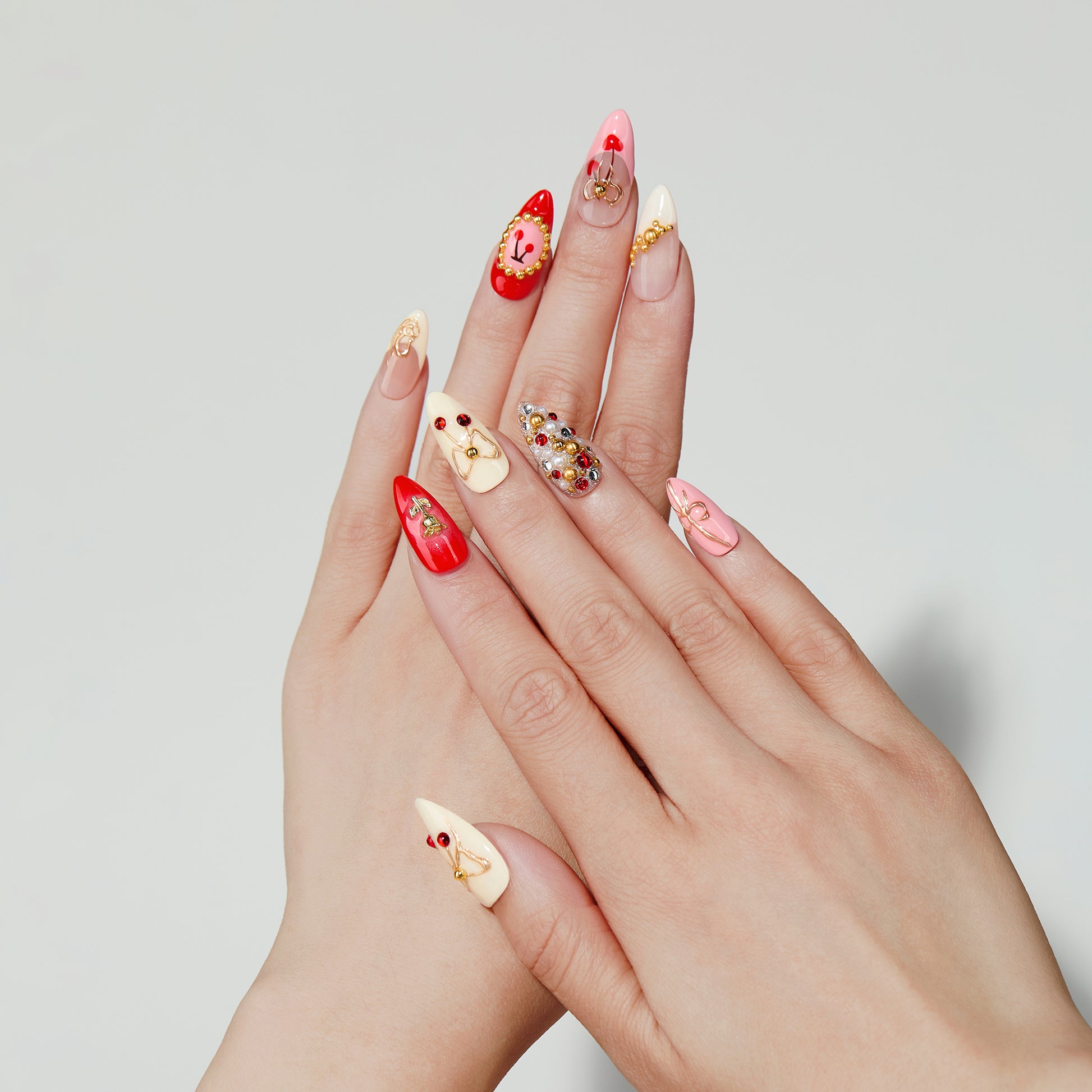 Cherry Luxe almond press-on nails hand close-up