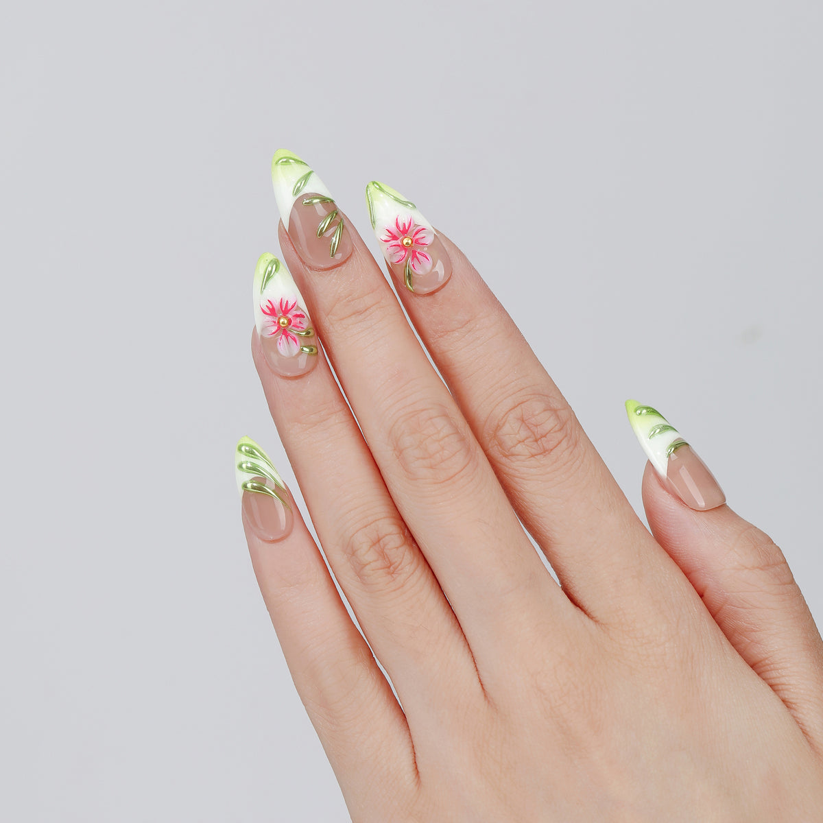 Traced Bloom almond press-on nails worn on hand