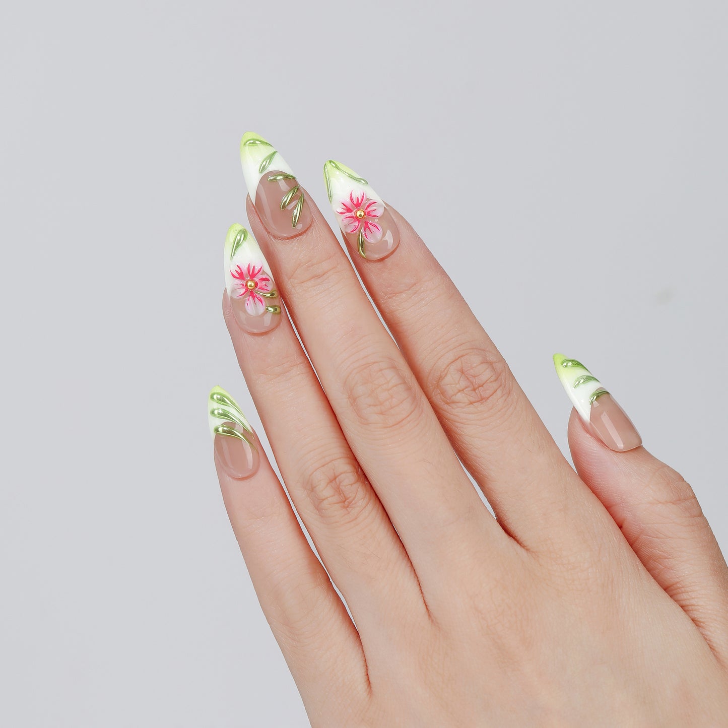 Traced Bloom almond press-on nails worn on hand
