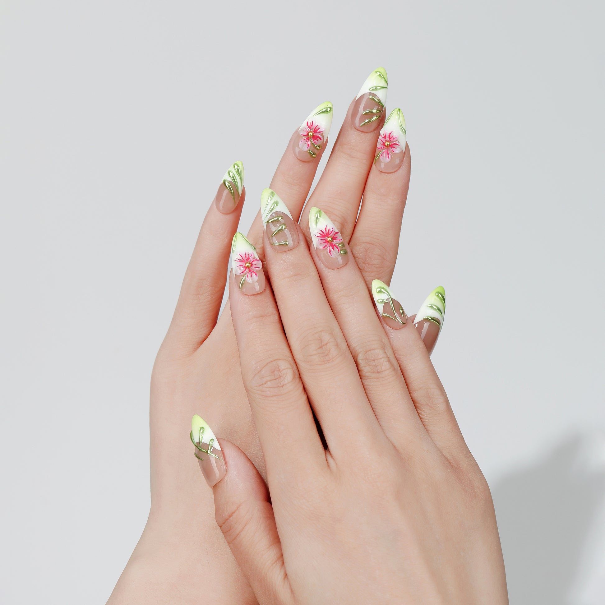 Traced Bloom almond press-on nails hand close-up