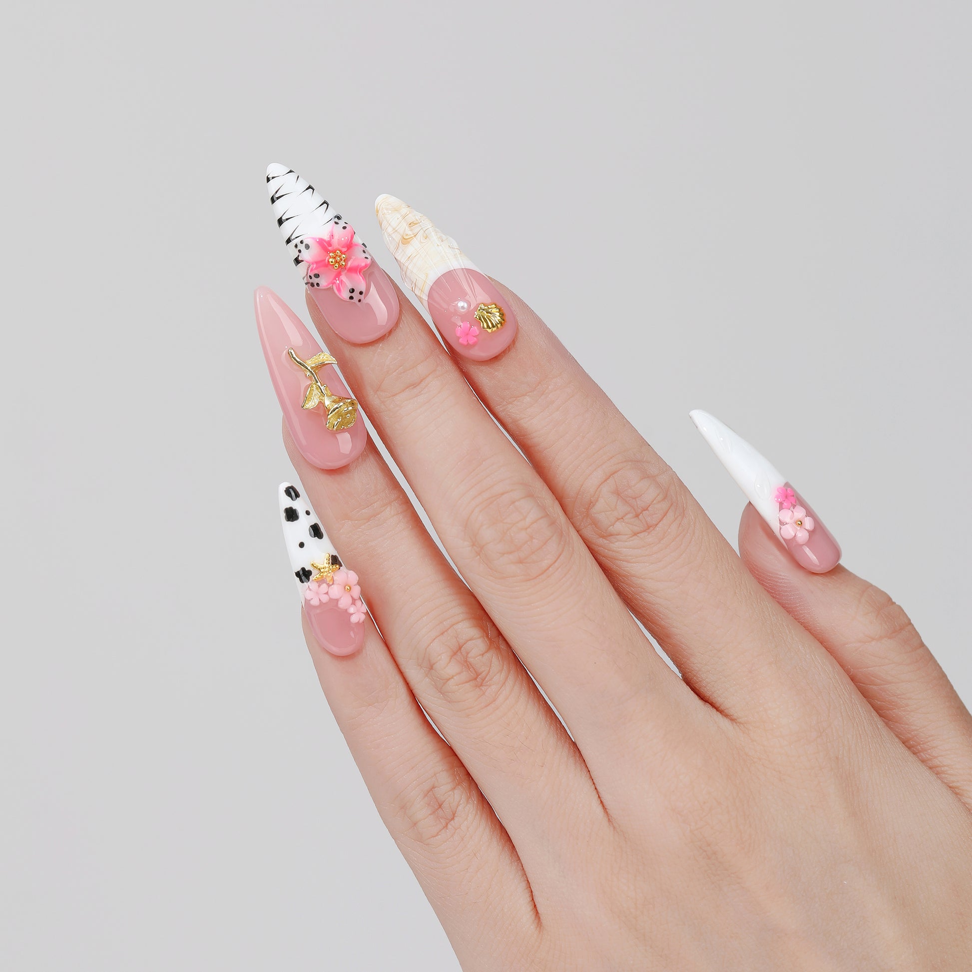 Sketch Bloom long almond press-on nails worn on hand