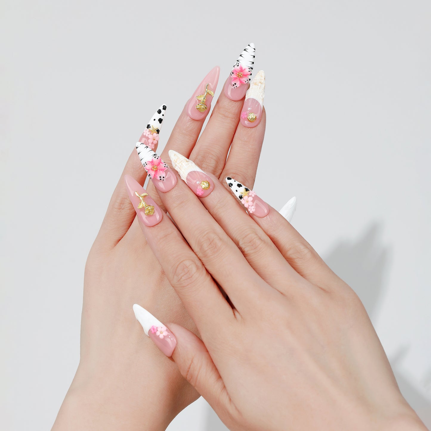 Sketch Bloom long almond press-on nails hand close-up