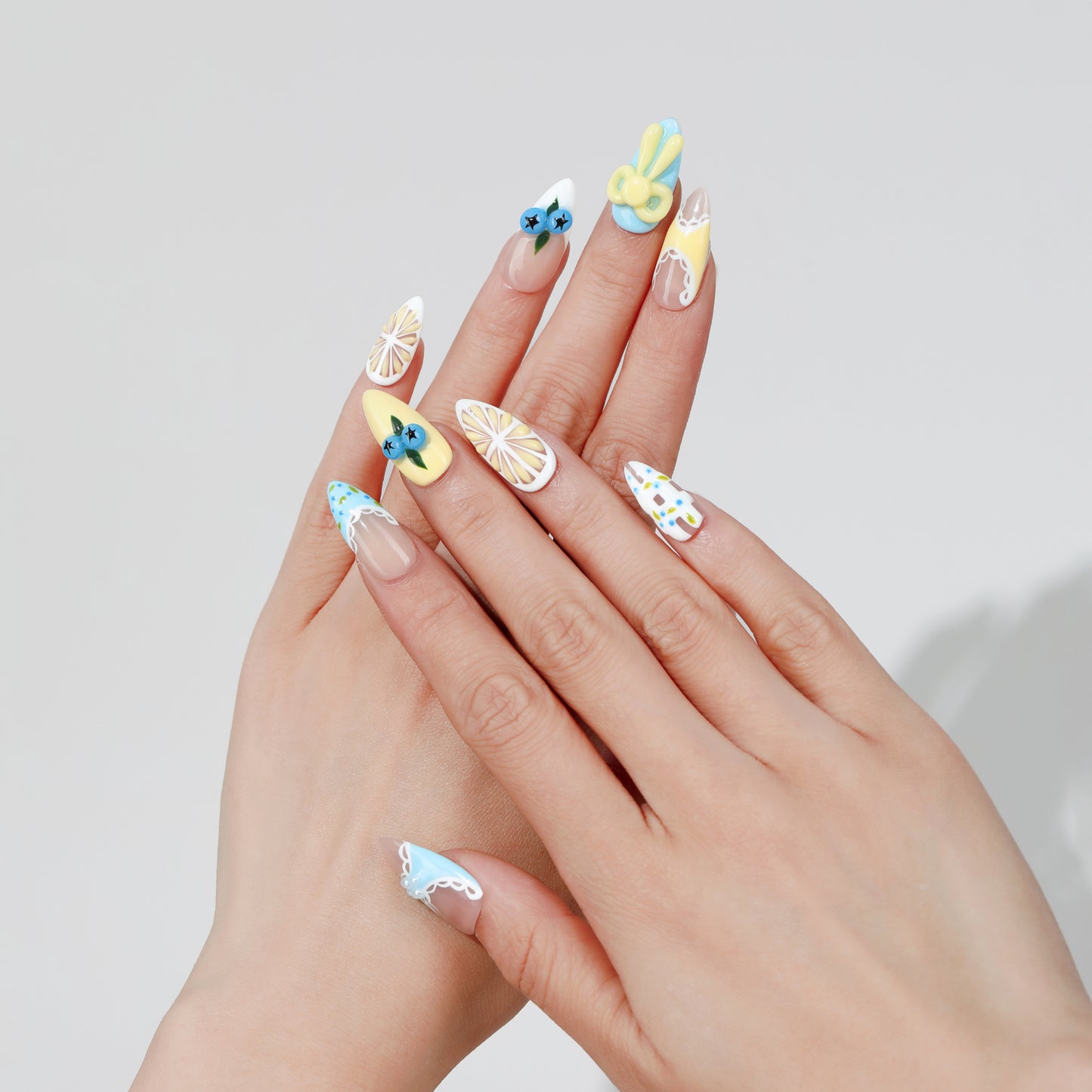 Cherry Star almond press-on nails worn on hand