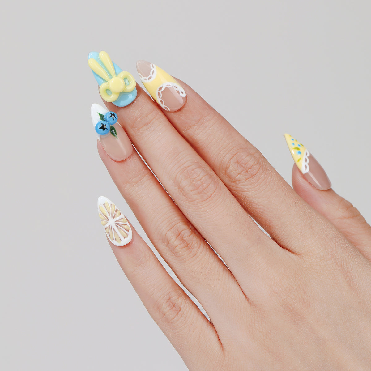 Cherry Star almond press-on nails hand close-up