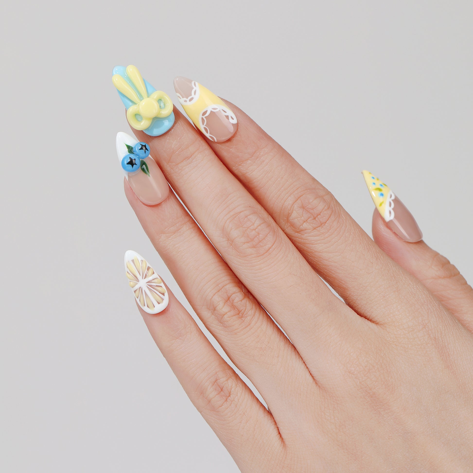 Cherry Star almond press-on nails hand close-up