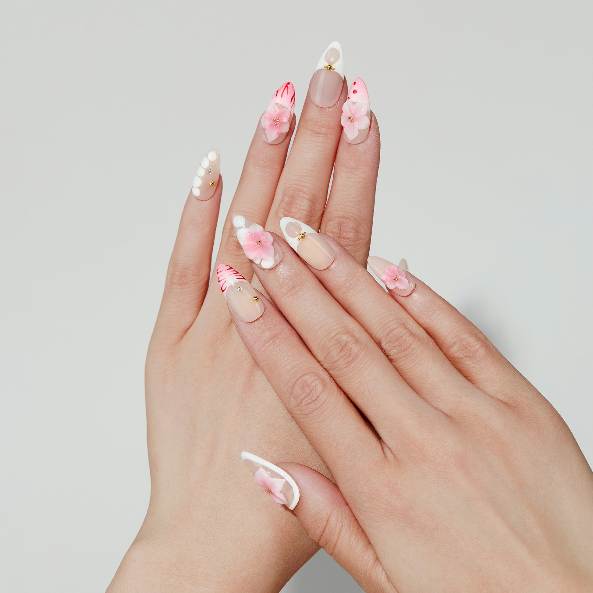 Sunset Bloom almond press-on nails worn on hand
