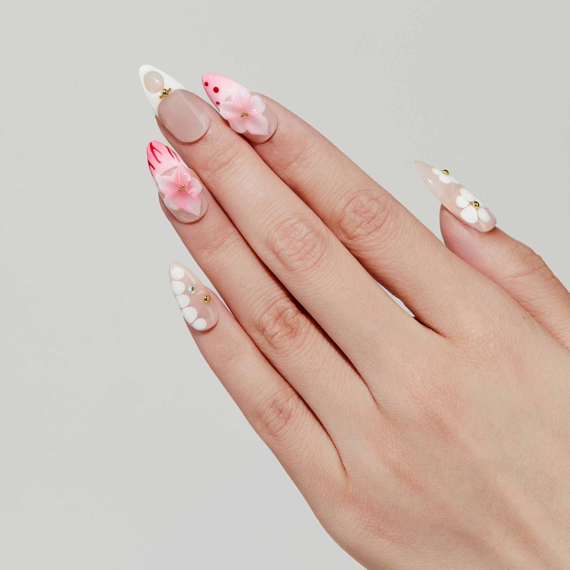 Sunset Bloom almond press-on nails hand close-up