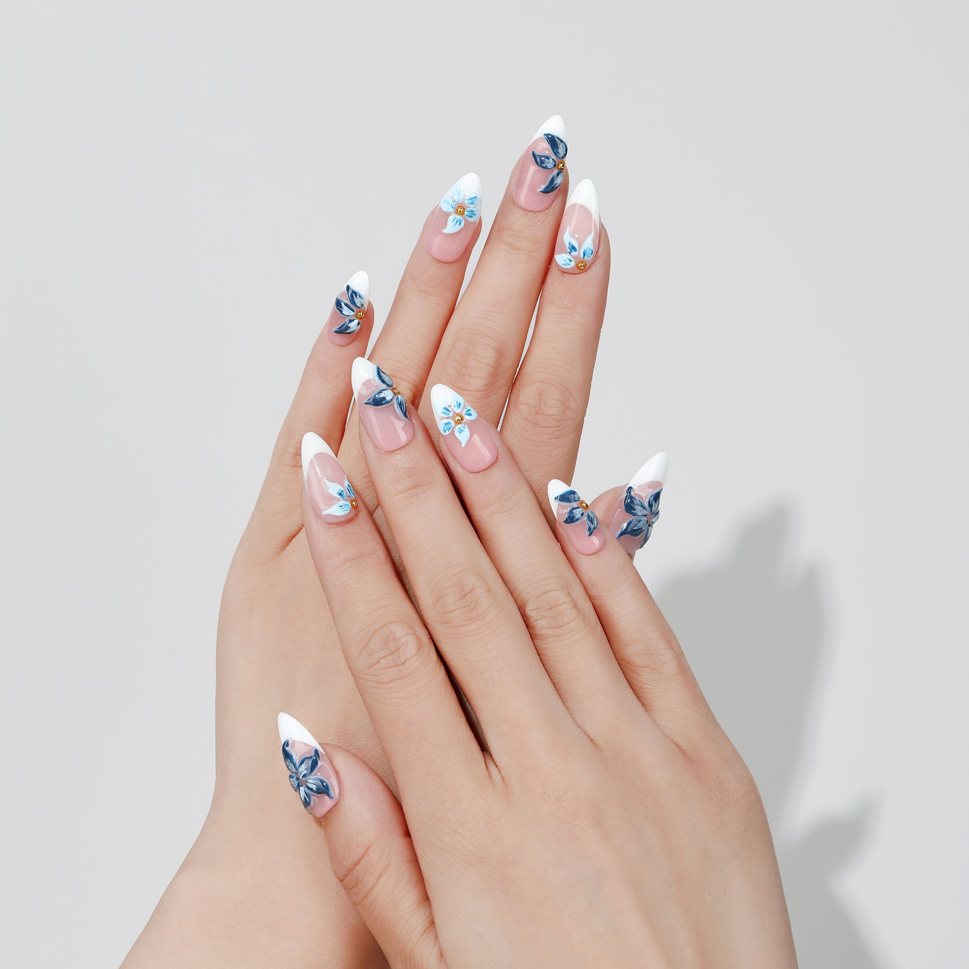 Blue Peony almond press-on nails hand close-up