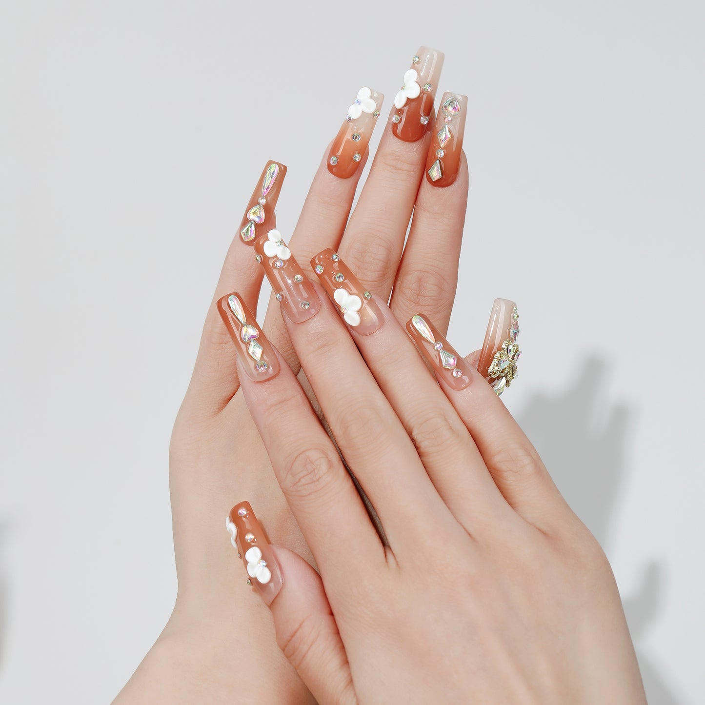 Amber Flora square press-on nails worn on hand