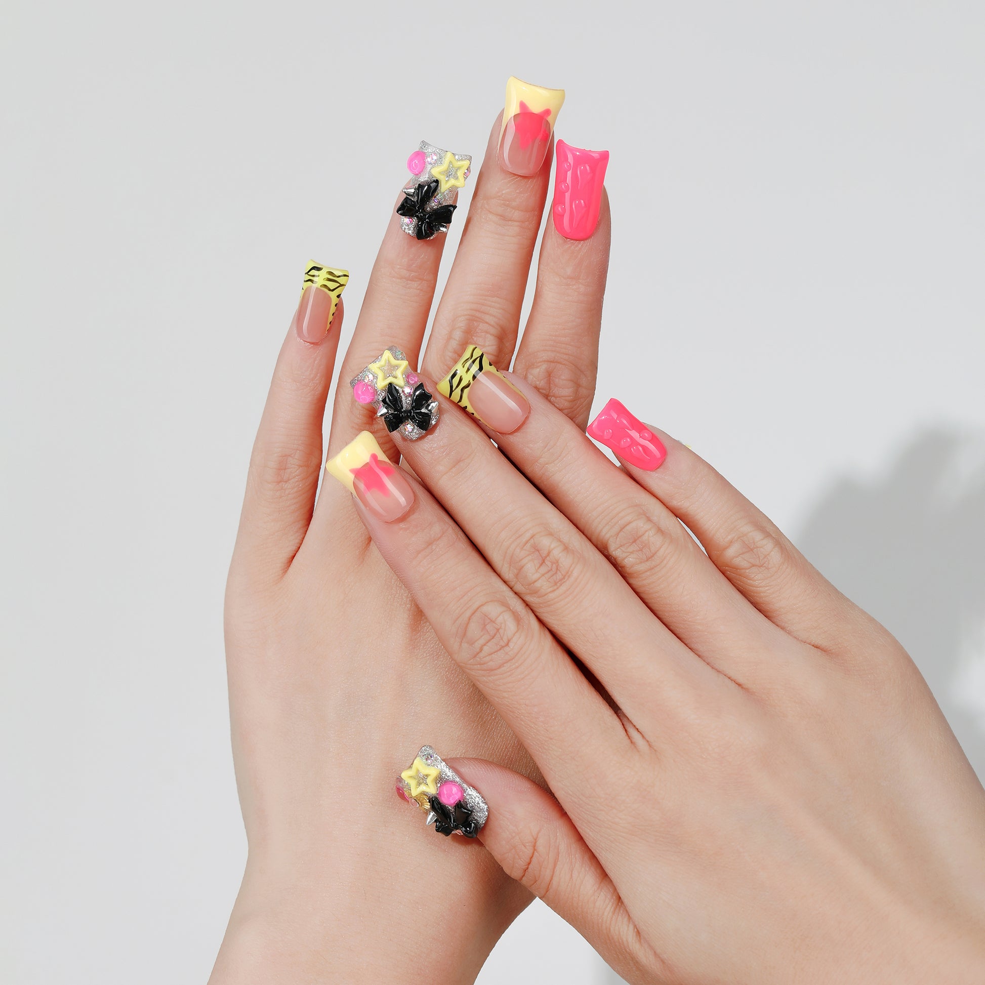 Starry Bow coffin press-on nails worn on hand