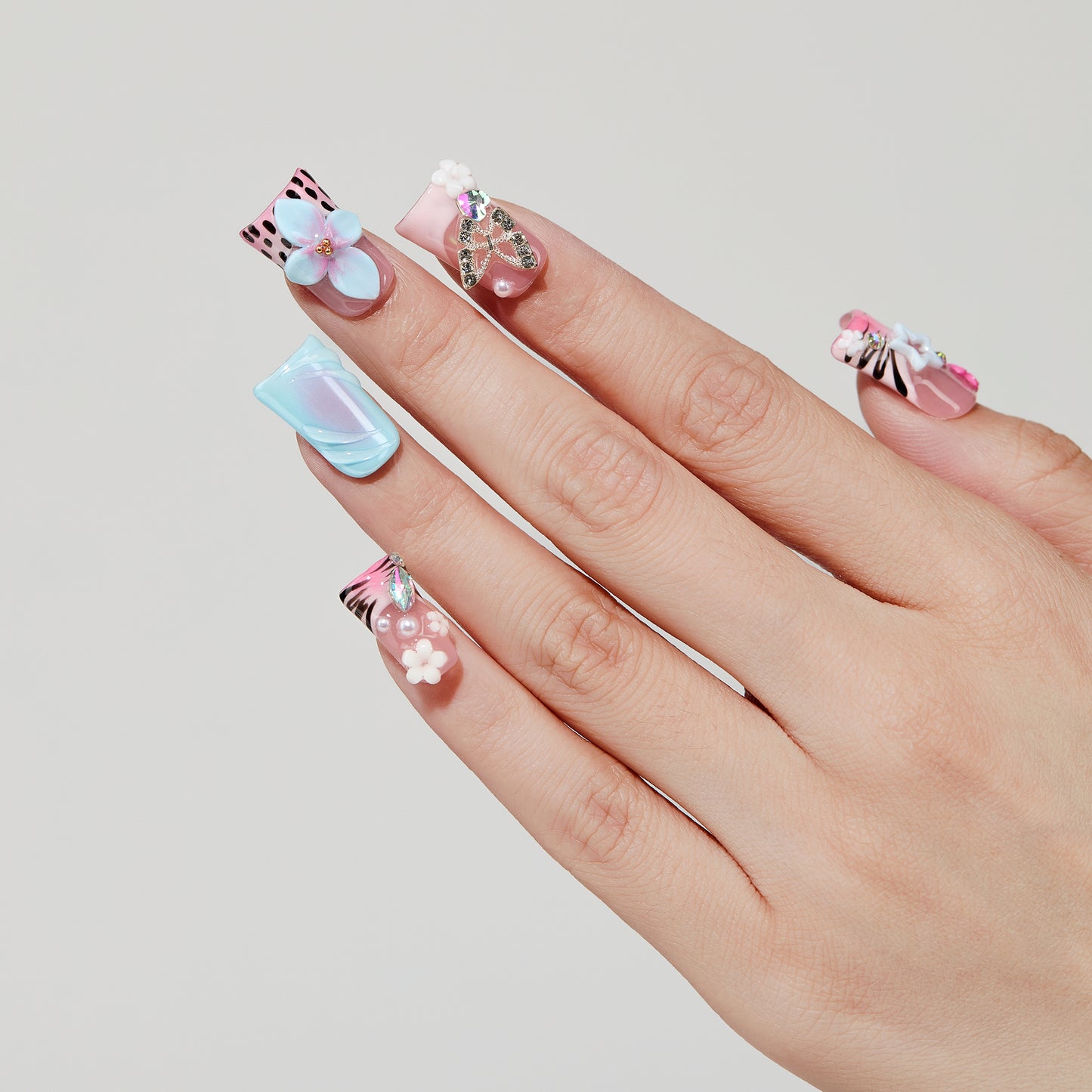 Color Carved coffin press-on nails worn on hand