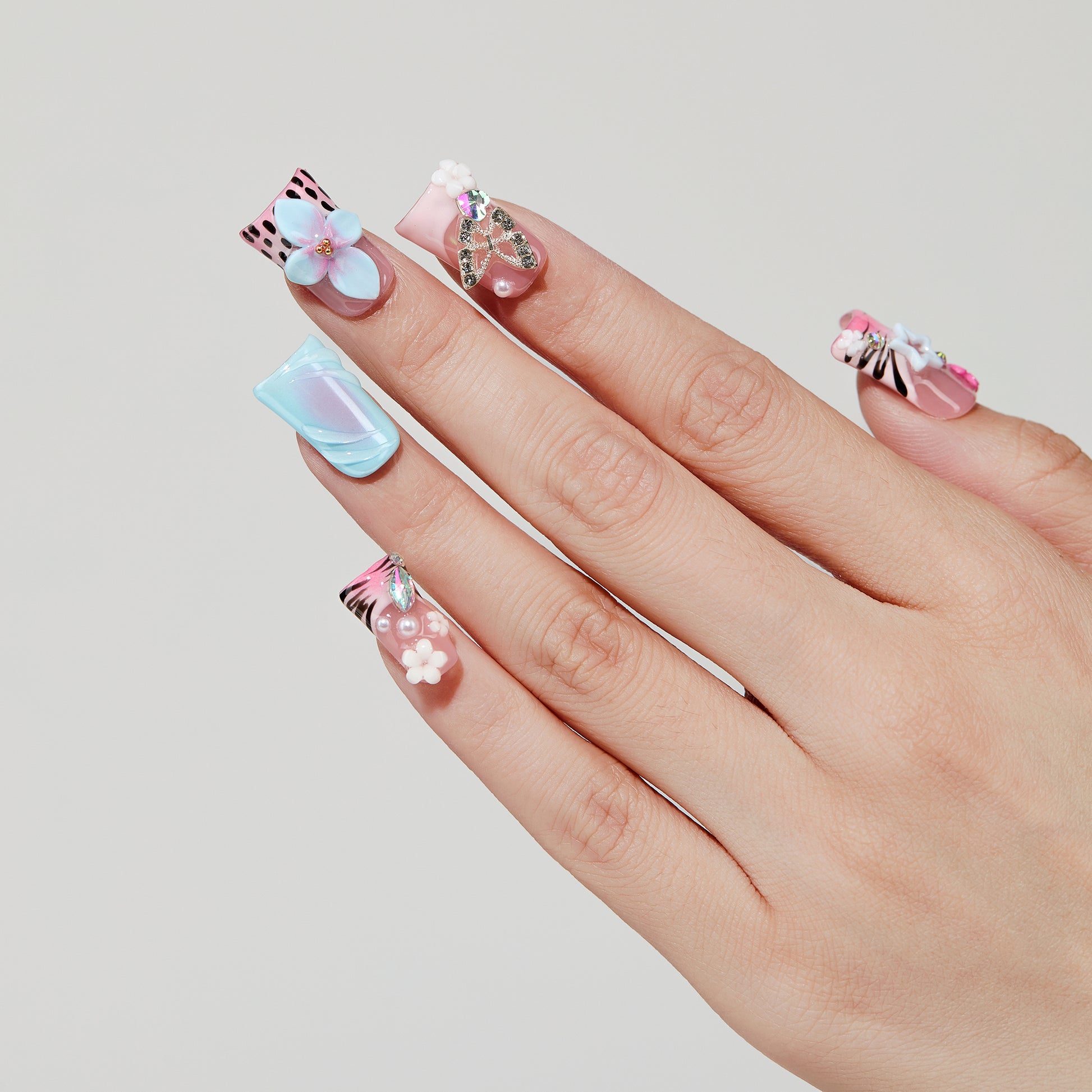 Color Carved coffin press-on nails worn on hand