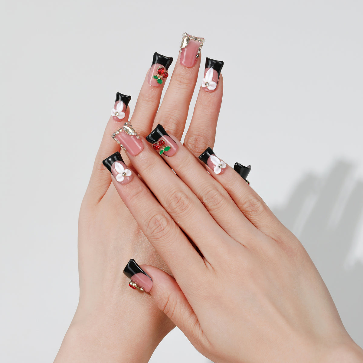 Sweet Cherry coffin press-on nails worn on hand